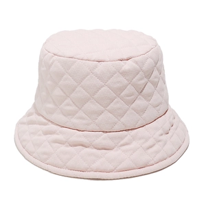 Detailed view of pink quilted bucket hat with diamond stitching and soft padded fabric