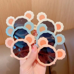Adorable children's sunglasses with cartoon bear ears and stylish round frames for kids