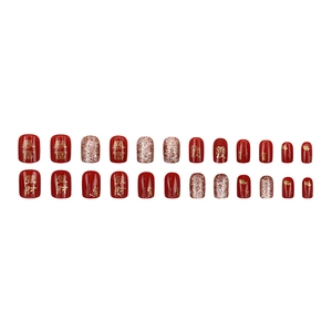Red and gold New Year press-on nails set with festive glitter and Chinese characters