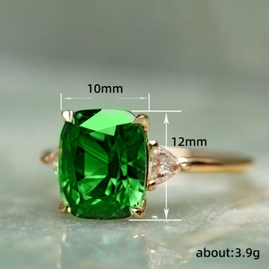 Golden ring with square green gemstone and triangle zircon stones, 10mm size, 3.9g weight
