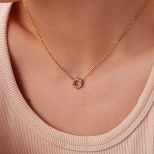 18K gold necklace with irregular round zircon pendant worn by model for elegant style