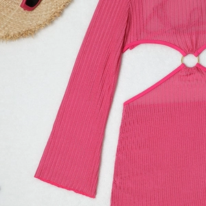 Detail of rose red crochet beach cover-up with knit texture and metal ring buckle