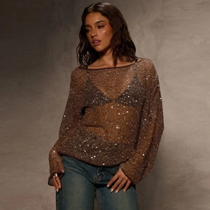 Close-up detail of brown sequined hollow-out knit top with long sleeves for women