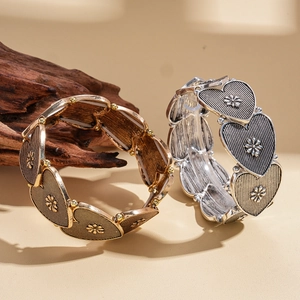 Vintage bronze and silver heart flower elastic bracelet with engraved metal textures