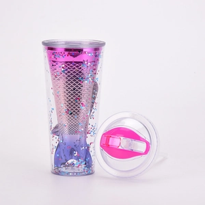 Close-up of double-walled straw cup featuring pink to purple gradient mermaid tail with sequins