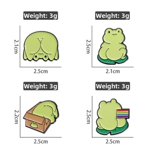 Detailed view of four creative cartoon frog enamel pins with dimensions and weight info