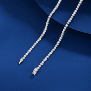 Classic 2mm S925 sterling silver tennis necklace with sparkling white zircons on blue background