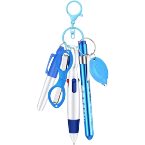 Nurse 6-piece tool set with mini LED light, folding scissors and ballpoint pen on white background