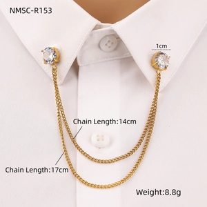 Detailed close-up of golden collar chain brooch with two 1cm cubic zirconia stones
