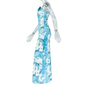 Side view of elegant blue and white abstract print long dress with backless halter design