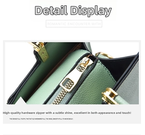 Detail of light green pebble leather handbag featuring a premium gold metal zipper closure