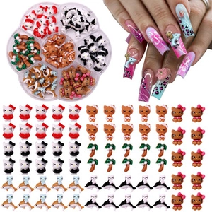 Detailed view of assorted Hello Kitty nail art sequins with application on fingernails