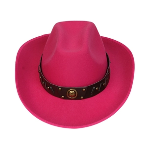 Close-up of rose red wool fedora featuring black band with gold studs and emblem