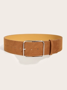 Detailed macro view of tan suede wide belt featuring a large square silver buckle