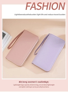 Close-up of pink and purple litchi grain leather long wallets with wrist straps