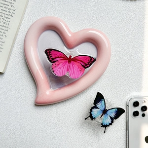 Detail of pink butterfly phone griptok on a heart frame with semi-transparent wings