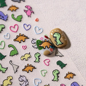 Cartoon dinosaur nail stickers with cute 3D patterns and colorful heart designs