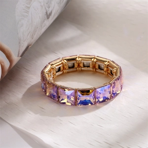 Detailed close-up of lavender purple crystal stretch bracelet with gold-tone metal base