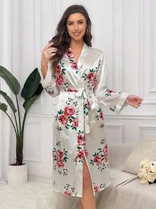 Close-up of white satin robe with red rose print and matching tie belt detail
