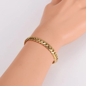Elegant gold-plated stainless steel dragon link bracelet worn on a female wrist