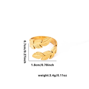 Detail view of 18k gold vintage feather ring with size specs and adjustable open design