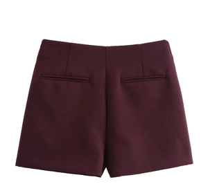 Detailed close-up of dark burgundy high-waisted skorts showing stitching and fabric texture