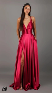 Detail view of deep red satin dress showing a high slit and sleek hidden side pockets