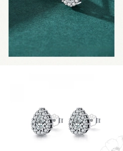 Detail shot of S925 sterling silver stamp on pear shaped cubic zirconia stud earrings