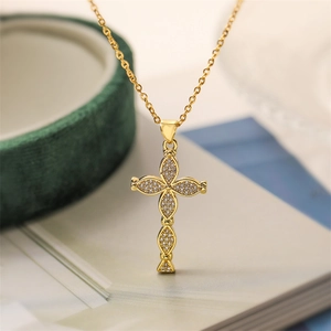 Sparkling gold cross necklace for women with clear zirconia stones and polished finish
