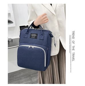 Blue oxford fabric backpack with durable top handle and spacious front zipper compartment