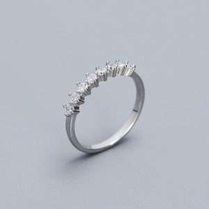 Close-up of sparkling cubic zirconia row on a minimalist 925 sterling silver ring band