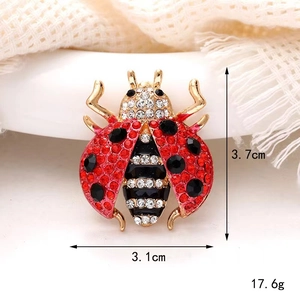 Detail view of ladybug brooch showing 3.7cm height and 3.1cm width dimensions