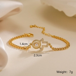 Detailed view of the 18K gold plated Hamsa Hand and Sun bracelet with small pearls