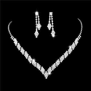 Elegant silver V-shaped necklace and drop earrings set with brilliant sparkling crystals