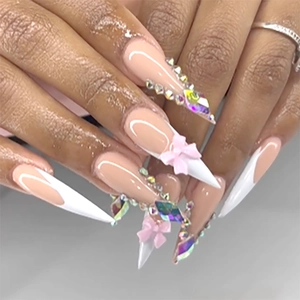Long stiletto press-on nails with white French tips, 3D bows and rhinestones