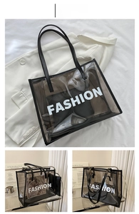 Detail of transparent brown PVC tote bag with leather inner pouch and FASHION lettering