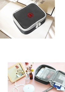 Macro detail of the grey travel medical bag showing red cross and mesh inner compartments