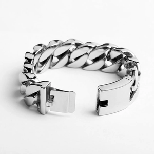 Detailed close-up of silver Cuban link chain bracelet with a durable plug-in clasp