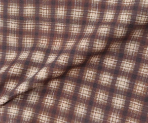 Vista detallada de la textura de la tela de cuadros marrón y beige y su patrón tejido
