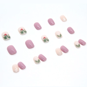 Press-on nails featuring purple tones, hand-painted tulips, and glitter accents set