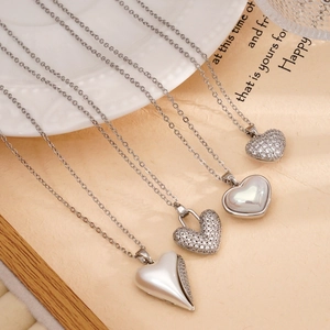 Elegant silver heart pendants with cubic zirconia and enamel on delicate steel chains