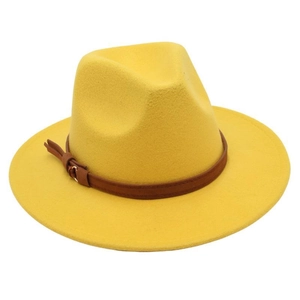 Detail of yellow wool fedora hat with a brown leather strap and classic metal buckle