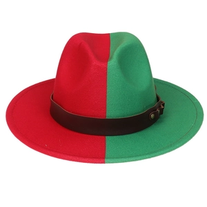 Detail view of two-tone red and green fedora hat with a brown leather belt and metal stud