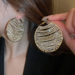Luxurious gold-tone geometric hoop earrings with brilliant white pavé-set zircons