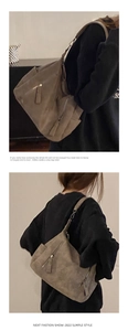 Detail of brown faux suede tote bag featuring pleated texture and vintage metal zipper