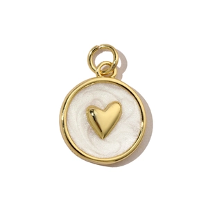 Detailed view of heart-shaped ocean pendant with white marble drip oil and gold finish