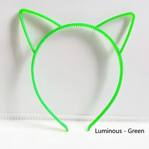 Macro view of green glow-in-the-dark cat ear headband with anti-slip teeth design