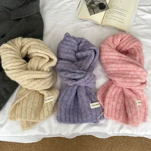 Soft wool-blend knit scarves in beige, purple, and pink with premium fabric labels
