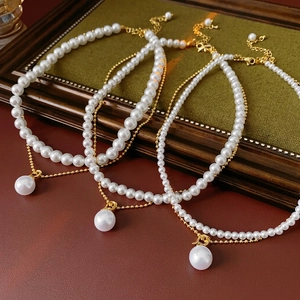 Elegant gold plated double-layer pearl necklace set with round faux pearl pendants