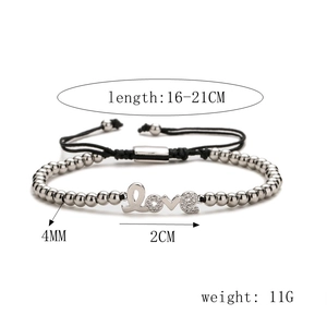 Detail view of adjustable silver beaded bracelet with zircon LOVE charm and pearls